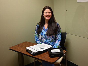 Ashe Memorial Hospital speech language pathologist Hannah Osborne, M.S., CCC-SLP, works with both inpatients and outpatients of all ages, specializing in the treatment of those who have suffered strokes, traumatic brain injuries, muscle loss and cognitive impairment following surgery, among other ailments.Photo of female speech language pathologist sitting at a table and smiling.